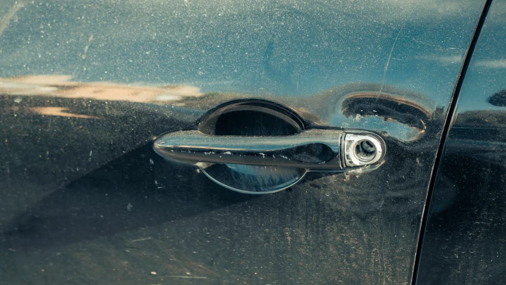 Car door with a broken lock close-up
