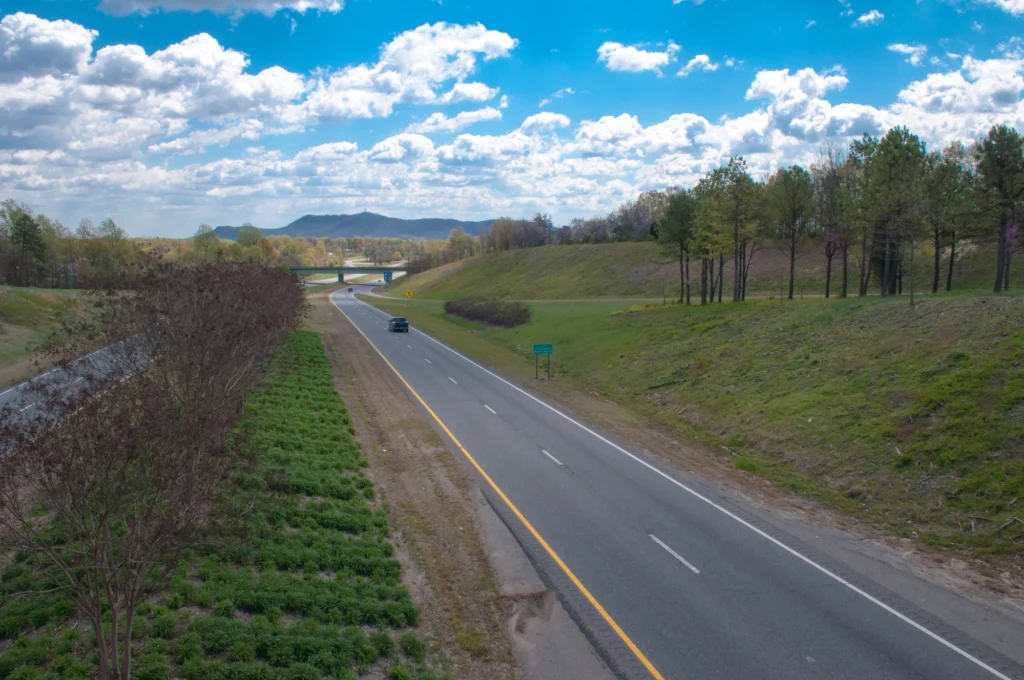 road going towards gastonia with crowders mountain in background